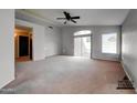 Spacious bedroom with backyard view and access to a private bathroom at 3128 E Millbrae Ln, Gilbert, AZ 85234