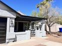 Charming home featuring a covered front porch and desert landscaping at 2930 E Leland St, Mesa, AZ 85213