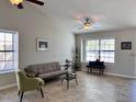 Bright living room with vaulted ceilings and an abundance of natural light at 2930 E Leland St, Mesa, AZ 85213