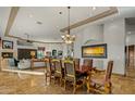 Open-concept dining area with elegant furnishings, flowing seamlessly to living spaces at 10911 E Taos Dr, Scottsdale, AZ 85262