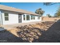 Large backyard with expansive concrete patio at 9127 W Banff Ln, Peoria, AZ 85381