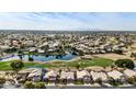 Property view showing house location near lake and golf course at 21956 N 59Th Ln, Glendale, AZ 85310