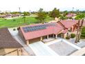 Single-story home with solar panels and a desert landscape at 18822 N Grandview Dr, Sun City West, AZ 85375