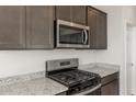 Stainless steel appliances and granite countertops in the kitchen at 1449 W Saddle Run, Apache Junction, AZ 85120