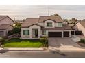 Two story home with a landscaped lawn and two car garage at 4503 E Decatur St, Mesa, AZ 85205