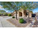 House exterior with driveway and mature trees at 41432 N Bent Creek Way, Phoenix, AZ 85086