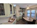 Charming dining area with built-in cabinets and an abundance of natural light at 17200 W Bell Rd # 569, Surprise, AZ 85374