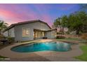 Inviting kidney-shaped pool with a large backyard at 3365 E Aris Dr, Gilbert, AZ 85298