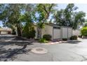 Exterior view of a home's corner and features neutral stucco and trimmed with green paint at 8101 N Central Ave # 6, Phoenix, AZ 85020