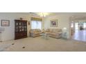 Bright living room with neutral tones, plush seating, and elegant decor at 29922 N Little Leaf Dr, San Tan Valley, AZ 85143