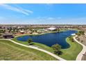 Beautiful aerial view showcasing community lake, pool, park and homes on a clear sunny day at 22882 E Marsh Rd, Queen Creek, AZ 85142