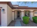 Front entry with security door and landscaped pathway at 42608 N 46Th Ave, New River, AZ 85087