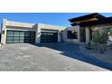 Three-car garage with modern glass doors at 28805 N 114Th St, Scottsdale, AZ 85262