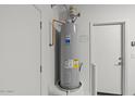 Newer water heater in a clean utility space at 18186 W Pima St, Goodyear, AZ 85338