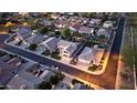 Aerial view of a house and neighborhood at dusk at 62 W Elmwood Pl, Chandler, AZ 85248