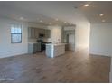 Open-concept kitchen featuring modern appliances and an island at 1018 W Finch Dr, Queen Creek, AZ 85140