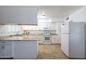 Bright kitchen with granite countertops and white cabinets at 4833 N 69Th Dr, Phoenix, AZ 85033