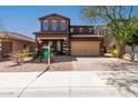 Charming two-story home with a well-manicured lawn and a two-car garage in a desirable neighborhood at 12687 W Caraveo Pl, Peoria, AZ 85383