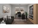 This home office features a sleek desk, comfortable seating, and ample storage in a naturally lit space at 12687 W Caraveo Pl, Peoria, AZ 85383