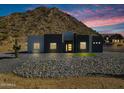 Contemporary home with desert landscaping and mountain backdrop at 31559 N Pamela Dr, Queen Creek, AZ 85144