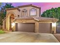 Charming two-story home showcasing a three car garage and desert landscaping at 1201 W Washington Ave, Gilbert, AZ 85233