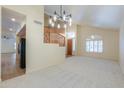 Bright living room with large windows, modern lighting, and seamless flooring at 695 W Estrella Dr, Gilbert, AZ 85233