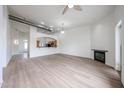 Inviting living room with wood floors, fireplace, and open access to the kitchen area at 4525 N 22Nd St # 404, Phoenix, AZ 85016