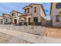 Inviting new construction home with a welcoming entryway and low-maintenance desert landscaping at 15598 S 181St Dr, Goodyear, AZ 85338