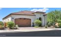 Charming single-story home featuring a beautiful tile roof and a spacious two-car garage at 35532 N Sunset Trl, San Tan Valley, AZ 85140