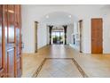 Spacious living room with tile floors and views to backyard at 10914 E Cinder Cone Trl, Scottsdale, AZ 85262