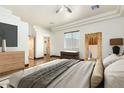 Bright bedroom featuring a king-size bed and wood flooring at 28301 N 154Th St, Scottsdale, AZ 85262