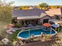 Home with a freeform pool, spa, and spacious backyard at 40903 N Harbour Town Way, Anthem, AZ 85086