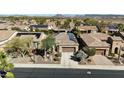 A single Gathering home with solar panels is nestled in a quiet neighborhood at 12364 W Rosewood Ln, Peoria, AZ 85383