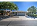 Single story home with a two-car garage and front yard at 29205 N Yellow Bee Dr, San Tan Valley, AZ 85143