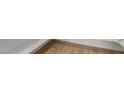 Close up on attractive and modern wood-look vinyl plank flooring at 11937 W Parkway Ln, Avondale, AZ 85323