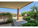 A well-maintained patio area with lush landscaping, a grill, and an outdoor dining set offers a delightful outdoor experience at 7161 E Rancho Vista Dr # 6001, Scottsdale, AZ 85251