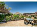 This comfortable patio area with a cozy dining set presents amazing views of the city at 7161 E Rancho Vista Dr # 6001, Scottsdale, AZ 85251