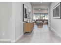 Entryway of home with tile floors and view into the living room with neutral color scheme at 21864 E Sunset Dr, Queen Creek, AZ 85142