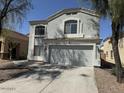 Charming home featuring a two-car garage and stucco exterior at 23200 W Ashleigh Marie Dr, Buckeye, AZ 85326