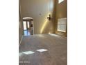 Bright living area with new carpet, recessed lighting, and a view to the kitchen and backyard at 29101 N Yellow Bee Dr, San Tan Valley, AZ 85143