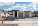 Charming single-story home with a two-car garage, neutral color palette, and low maintenance desert landscaping at 22717 E Lords Way, Queen Creek, AZ 85142