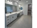 Bright, modern bathroom featuring double sinks, spacious vanity, and ample storage at 10262 W Columbus Ave, Avondale, AZ 85392