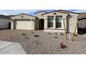 Well-maintained front yard with desert landscaping and a charming exterior at 10262 W Columbus Ave, Avondale, AZ 85392