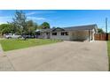 Newly renovated home with a spacious yard and a long driveway at 934 E 8Th St, Mesa, AZ 85203