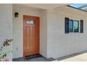Modern front door with updated hardware and a welcoming mat at 934 E 8Th St, Mesa, AZ 85203