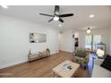 Light-filled living room featuring hardwood floors and stylish furniture at 1302 E Maryland Ave # 15, Phoenix, AZ 85014