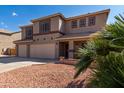 Two-story house with a three-car garage and desert landscaping at 4321 E Morenci Rd, San Tan Valley, AZ 85143