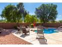Inviting backyard oasis with a sparkling pool and patio furniture at 4321 E Morenci Rd, San Tan Valley, AZ 85143