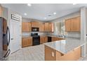 Modern kitchen with granite countertops and stainless steel appliances at 17425 W Willow Ave, Surprise, AZ 85388