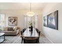 Dining room boasting modern lighting fixtures and stylish decor at 10851 E Le Marche Dr, Scottsdale, AZ 85255